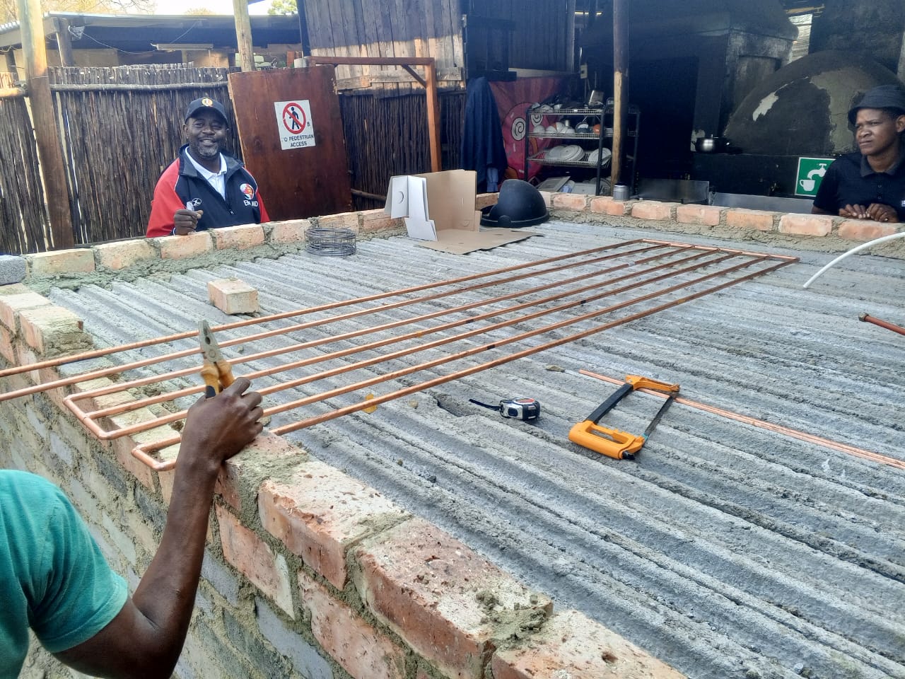 Copper piping work in progress with team on site