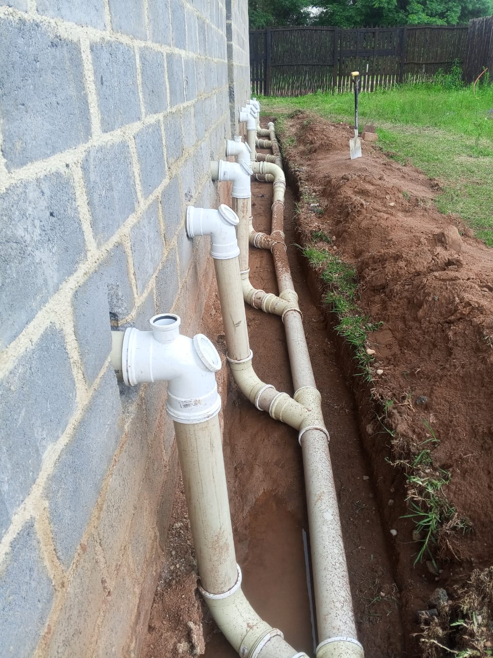 Exterior pipe installation trench